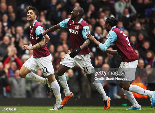 Manuel da Costa of West Ham United celebrates with team mates Demba Ba and Frederic Piquionne after scoring during the Barclays Premier League match...