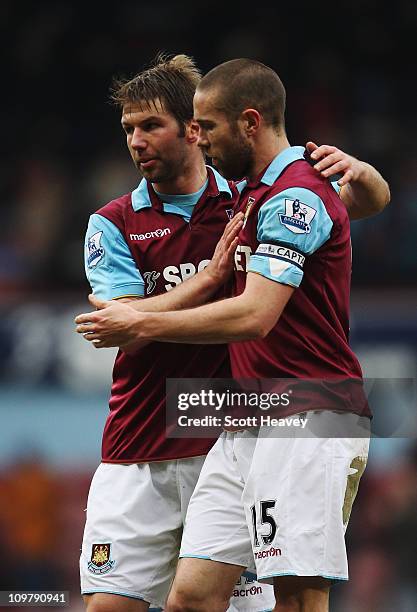 Thomas Hitzlsperger of West Ham United celebrates with team mate Matthew Upson after the Barclays Premier League match between West Ham United and...