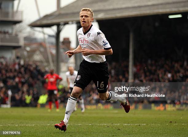Damien Duff of Fulham celebrates scoring the first goal during the Barclays Premier League match between Fulham and Blackburn Rovers at Craven...