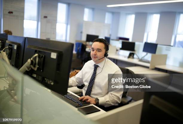 Conor Sprouls, a Global Customer Solutions Specialist, works at the Met Life call center in Warwick RI on Jan. 25, 2019. The call center uses AI...