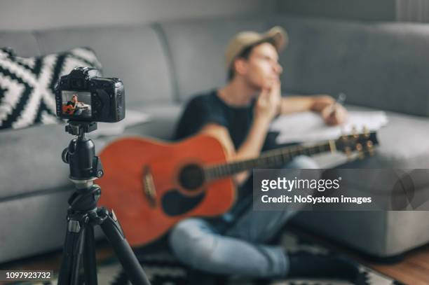 young vlogger, guitarist filming his vlogg - stars and strings 2019 stock pictures, royalty-free photos & images