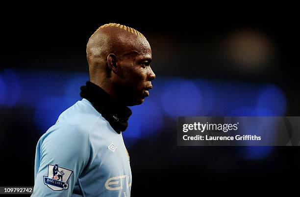 Mario Balotelli of Manchester City looks on during the Barclays Premier League match between Manchester City and Wigan Athletic at the City of...