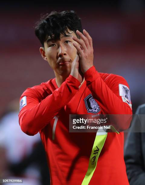 Son Heung-Min of South Korea applauds the crowd after the AFC Asian Cup round of 16 match between South Korea and Bahrain at Rashid Stadium on...