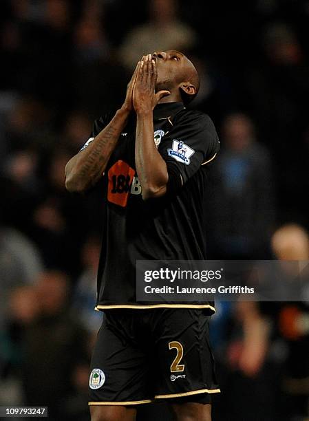 Steve Gohouri of Wigan Athletic looks dejected at the end of the Barclays Premier League match between Manchester City and Wigan Athletic at the City...
