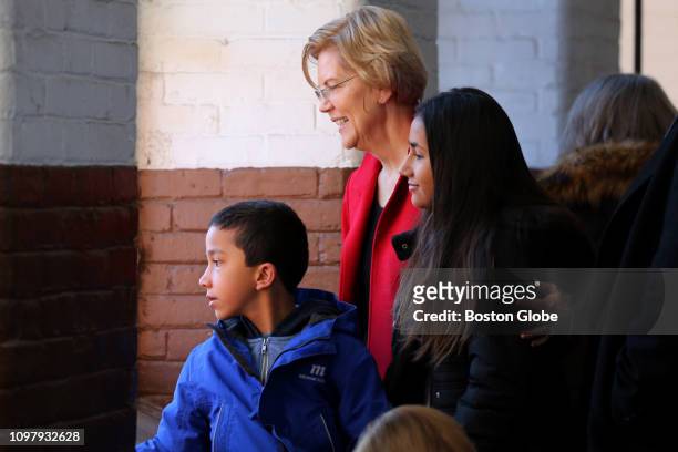 Senator Elizabeth Warren looks over the crowd with her grandchildren Atticus and Lavinia Tyagi before officially announcing her run for the...