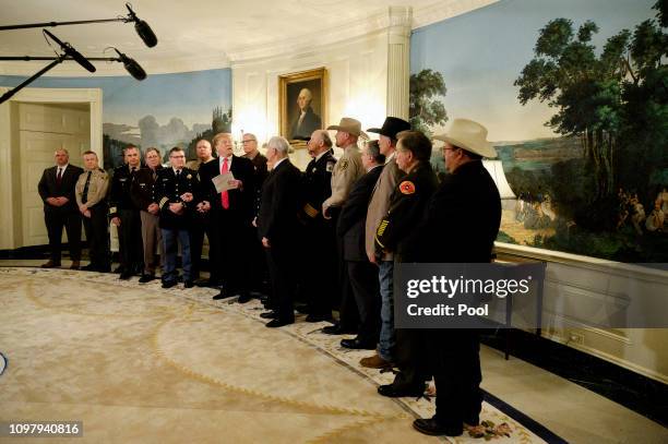 President Donald Trump speaks to the press after meeting with sheriffs from across the country in the Diplomatic Reception Room at the White House...
