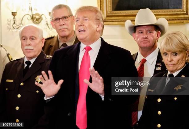 President Donald Trump speaks to the press after meeting with sheriffs from across the country in the Diplomatic Reception Room at the White House...