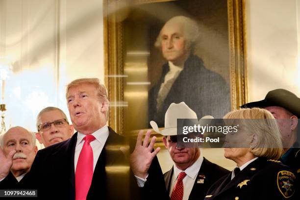 President Donald Trump speaks to the press after meeting with sheriffs from across the country in the Diplomatic Reception Room at the White House...
