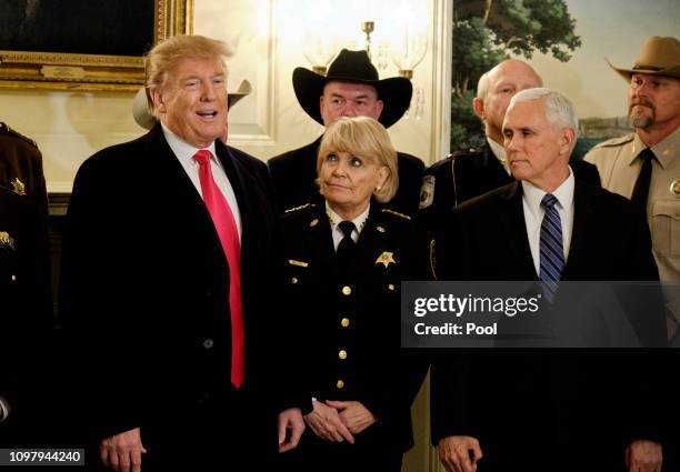 President Donald Trump, with Vice President Mike Pence, speaks to the press after meeting with sheriffs from across the country in the Diplomatic...