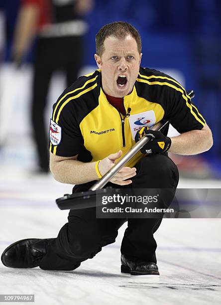 Team New Bruinswick second Steve Howard calls for teammates to sweep hard in a game against Team Ontario in the 2011 Tim Horton's Brier Canadian...