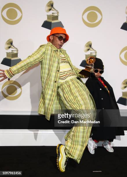 Anderson .Paak and his son Soul Rasheed pose in the press room with his award for Best Rap Performance award for 'Bubblin,' during the 61st Annual...