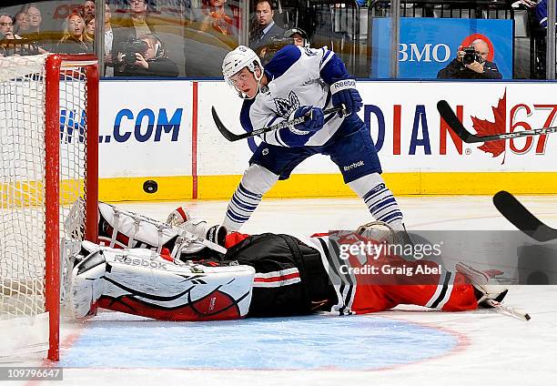 Tyler Bozak of the Toronto Maple Leafs is stopped in close by Corey Crawford of the Chicago Blackhawks March 5, 2011 at the Air Canada Centre in...