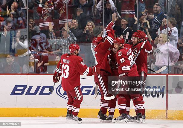 Martin Hanzal of the Phoenix Coyotes celebrates with teammates Ray Whitney, David Schlemko, Radim Vrbata and Michal Rozsival after Hanzal scored a...