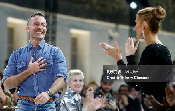 Singer Celine Dion applauds designer Alexandre Vauthier as he appears at the end of the Alexandre Vauthier Spring Summer 2019 show as part of Paris...