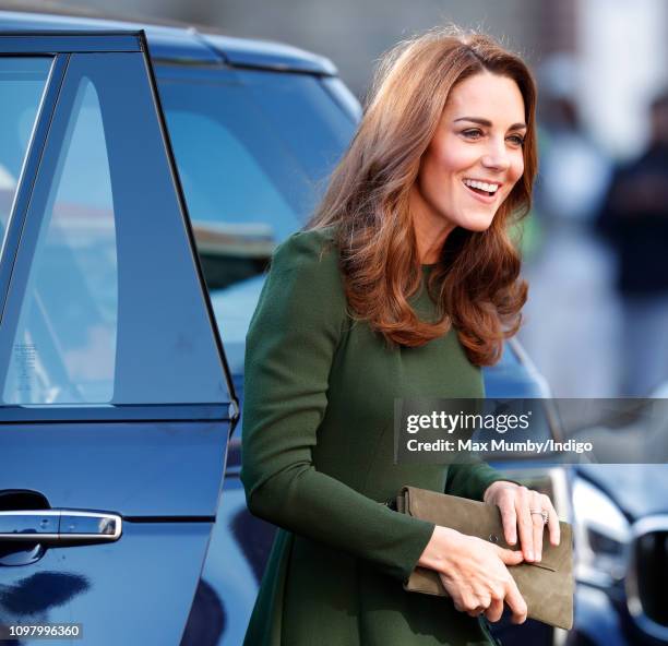 Catherine, Duchess of Cambridge gets out of her Range Rover car as she arrives for a visit to Family Action to launch a new national support line on...