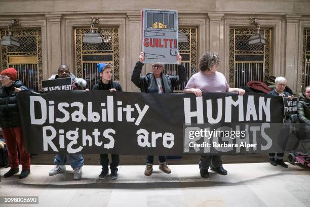 View of demonstrators as they hold a banner during the Non-March For Disabled Women inside Grand Central Station, New York, New York January 19,...