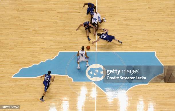 Kyle Singler of the Duke Blue Devils goes after a loose ball with Harrison Barnes of the North Carolina Tar Heels during their game at the Dean E....