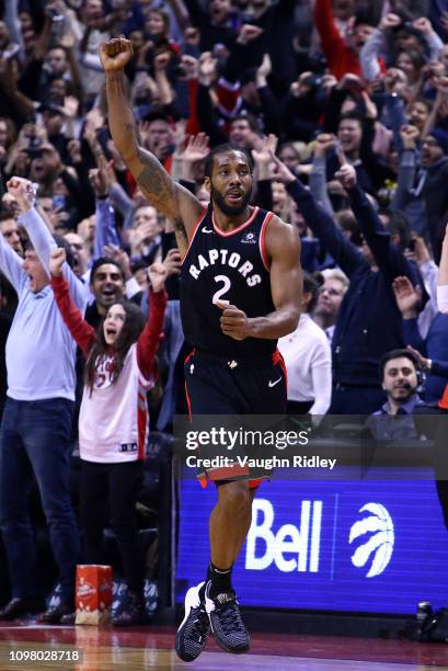 Kawhi Leonard of the Toronto Raptors celebrates scoring the winning basket during the second half of an NBA game against the Brooklyn Nets at...