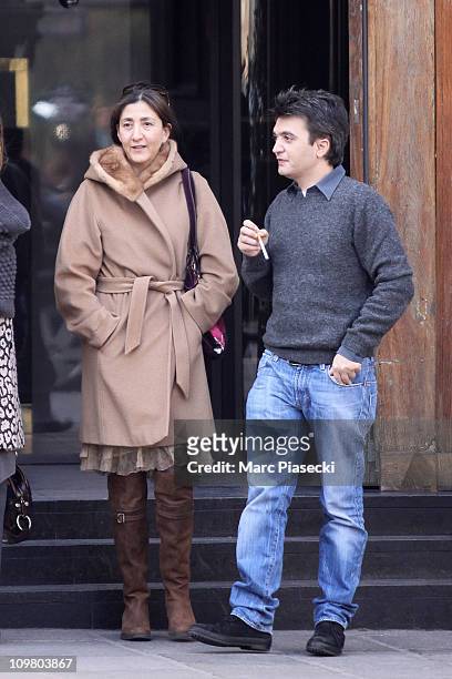 Ingrid Betancourt and movie producer Thomas Langmann leave the 'La Societe' restaurant on March 5, 2011 in Paris, France.