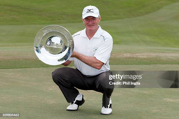 Chris Williams of South Africa poses with the trophy after the final round of The Aberdeen Brunei Senior Masters presented by The Stapleford Forum...