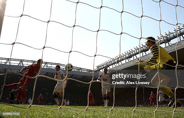 Dirk Kuyt of Liverpool scores his team's second goal during the Barclays Premier League match between Liverpool and Manchester United at Anfield on...