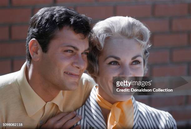 Actors Janet Leigh and Tony Curtis pose for a portrait in 1960 in Los Angeles, California.