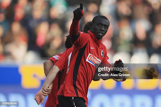 Papiss Demba Cisse of Freiburg celebrates his team's first goal during the Bundesliga match between SC Freiburg and SV Werder Bremen at Badenova...