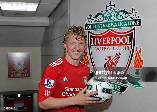 Liverpool's Dirk Kuyt with the hat-trick ball at the end of Barclays Premier League match between Liverpool and Manchester United at Anfield on March...