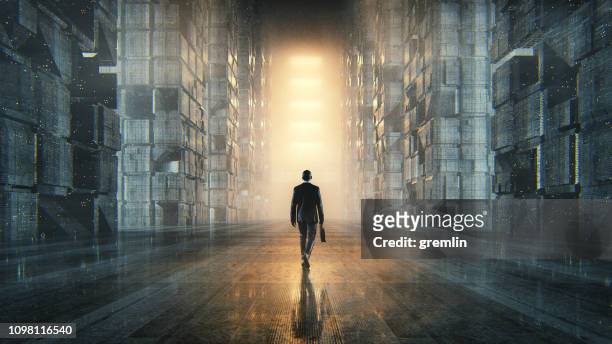 businessman walking in dark futuristic city - businessman silhouette stock pictures, royalty-free photos & images