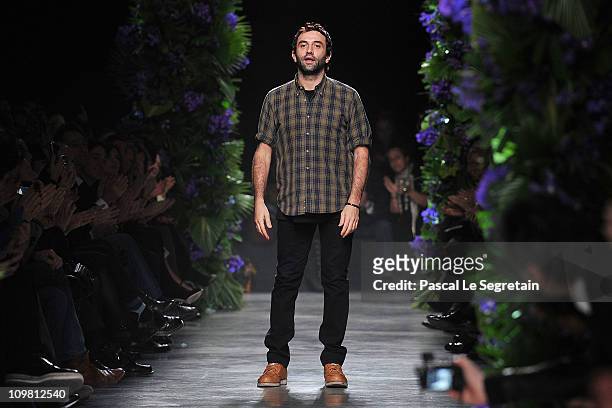 Designer Riccardo Tisci walks the runway during the Givenchy Ready to Wear Autumn/Winter 2011/2012 show at the Palais de Tokyo during Paris Fashion...