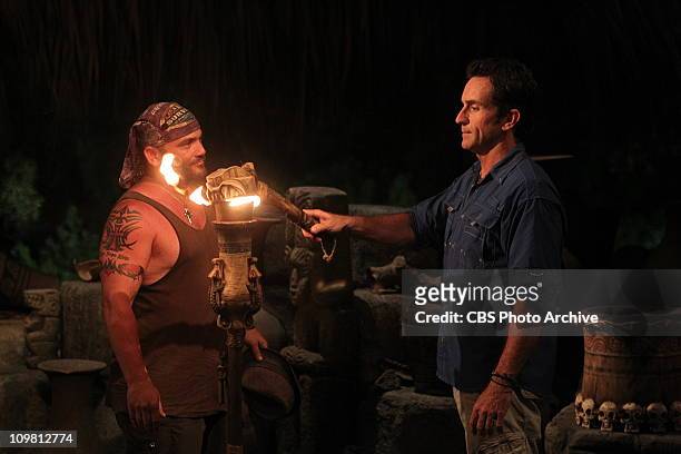 Russell Hantz, of the Zapatera tribe, has his torch snuffed out by Jeff Probst, during tribal council, during the third episode of Survivor:...