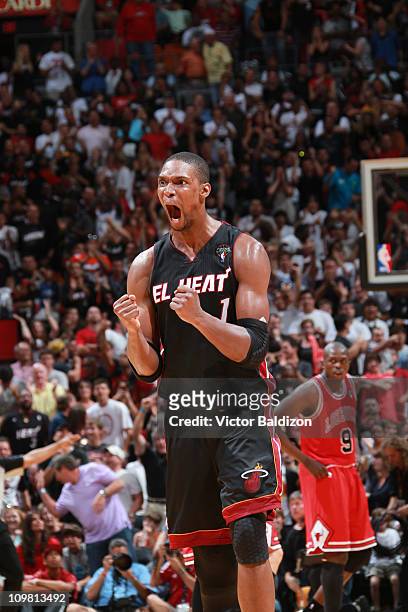 Chris Bosh of the Miami Heat reacts after a play against the Chicago Bulls on March 6, 2011 at American Airlines Arena in Miami, Florida. NOTE TO...