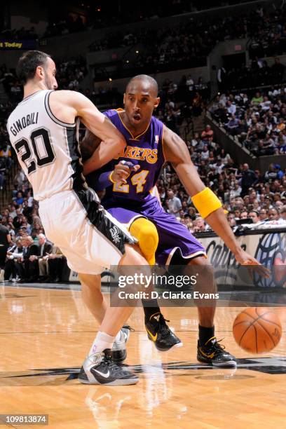 Kobe Bryant of the Los Angeles Lakers drives against Manu Ginobili of the San Antonio Spurs at AT&T Center on March 6, 2011 in San Antonio, Texas....