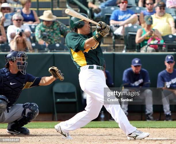 Hideki Matsui of Oakland Athletics at bat during the spring training game with Milwaukee Brewers at Phoenix Municipal Stadium on March 6, 2011 in...