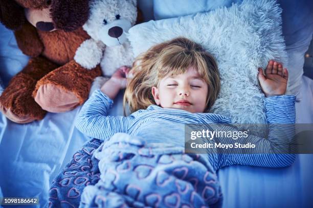 off to dream land - child asleep in bedroom at night stock pictures, royalty-free photos & images