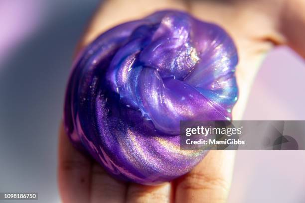 galaxy slime on the desk - slimed stock pictures, royalty-free photos & images