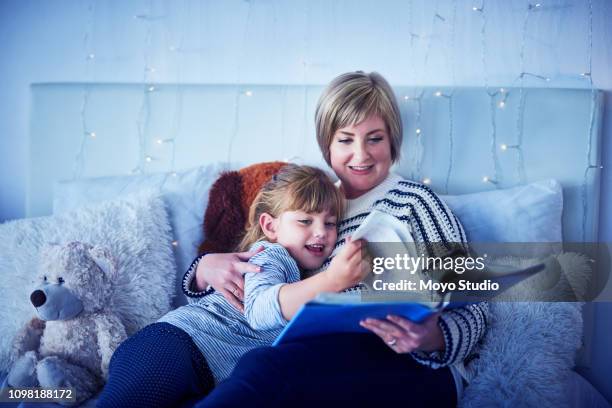 nothing more soothing like a bedtime story - bedtime stock pictures, royalty-free photos & images
