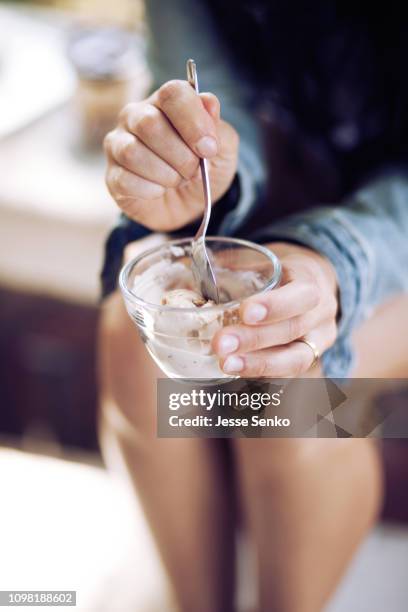 woman tasting homemade homemade strawberry ice cream - homemade icecream stock pictures, royalty-free photos & images