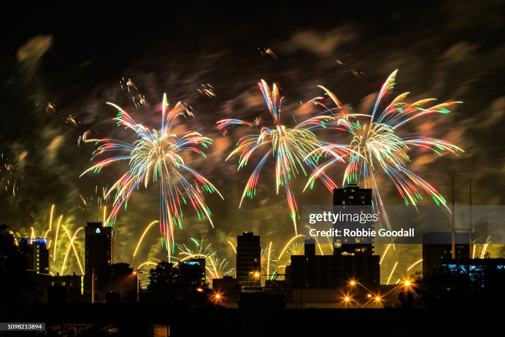 Colourful fireworks over city buildings