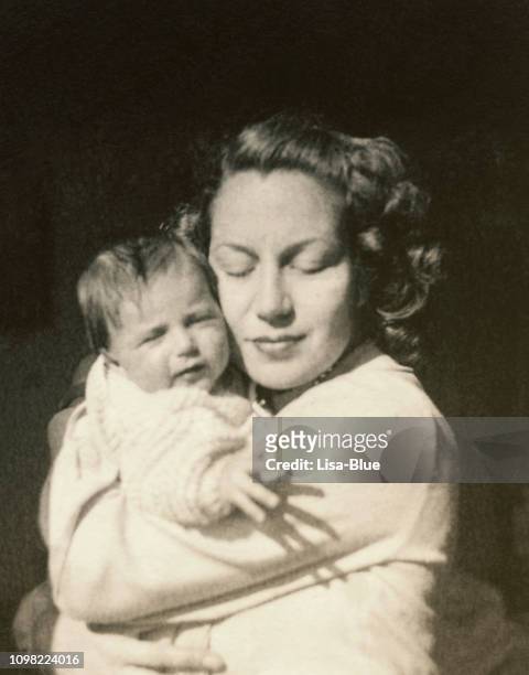 young mother with her baby in 1948 - 1940s bedroom stock pictures, royalty-free photos & images