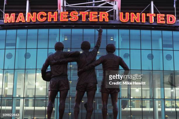 Statue of George Best, Denis Law and Bobby Charlton standing outside Old Trafford, home of Manchester United on March 2, 2011 in Manchester, England.