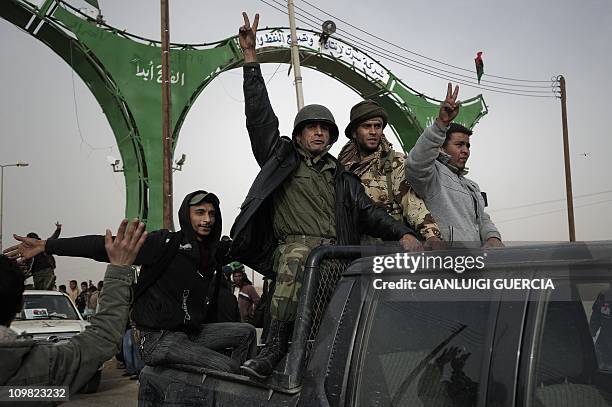 Libyan rebel fighters celebrate as they, News Photo