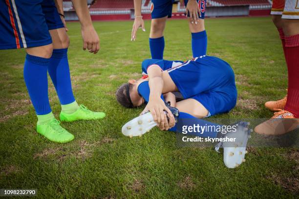 soccer injury on playing field! - soccer injury stock pictures, royalty-free photos & images