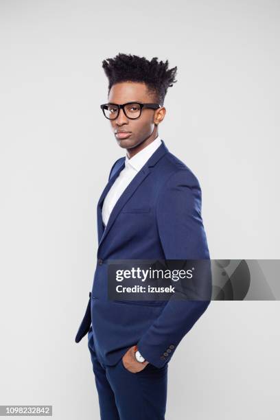 handsome afro american businessman in studio - stereotypically upper class stock pictures, royalty-free photos & images