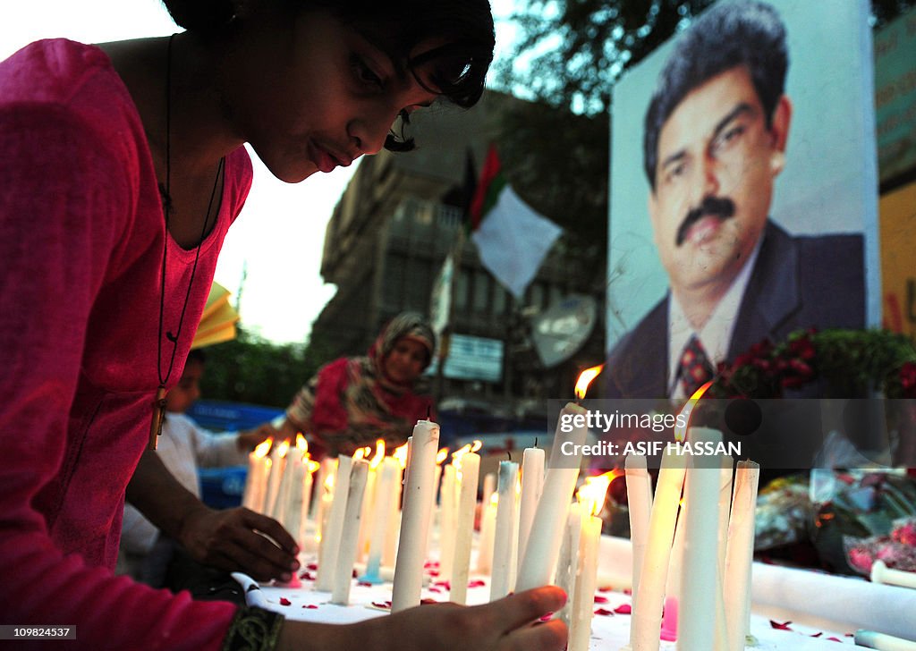 A Pakistani Christian girl lights candle