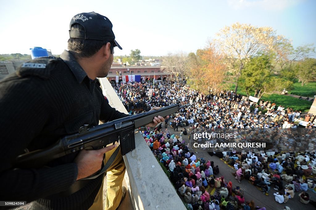 A Pakistani policeman stands guard durin