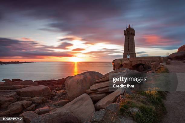 the ploumanac'h lighthouse at sunset (officially the mean ruz lighthouse), brittany/ france - perros guirec stock pictures, royalty-free photos & images