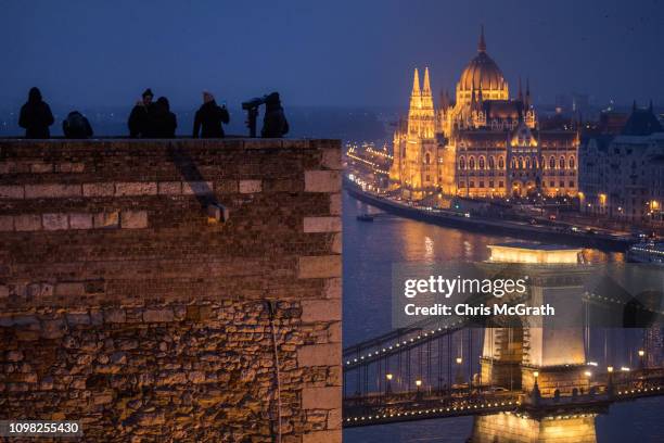 People look out over The Hungarian Parliament Building on January 20, 2019 in Budapest, Hungary. The Parliament building has become a site of growing...