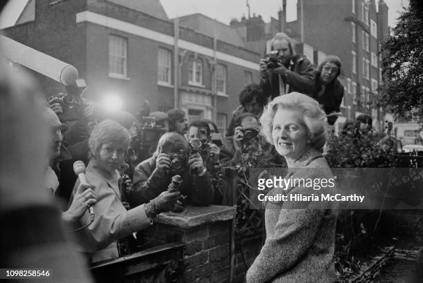 British Conservative Party politician Margaret Thatcher meets the press outside her house after being elected as Leader of the Conservative Party,...