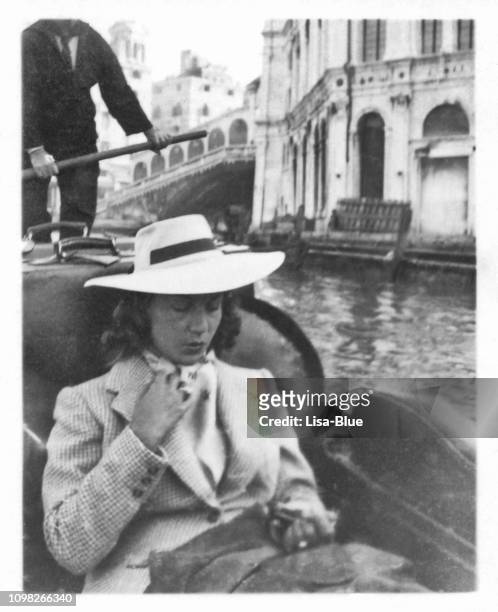 young beautiful woman on gondola in venice in 1941 - gondolier stock pictures, royalty-free photos & images